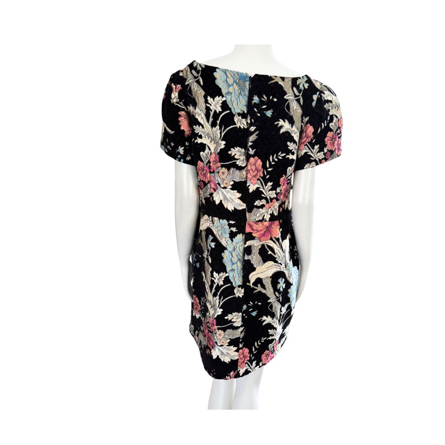 Floral dress on a mannequin against a white background