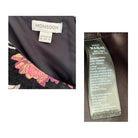 Close-up of a Monsoon label on a garment with embroidered details.