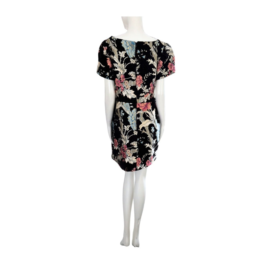 Floral dress on a mannequin against a white background