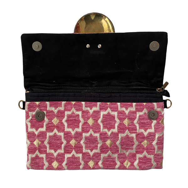 internal Black pouch with a pink geometric patterned flap on a white background