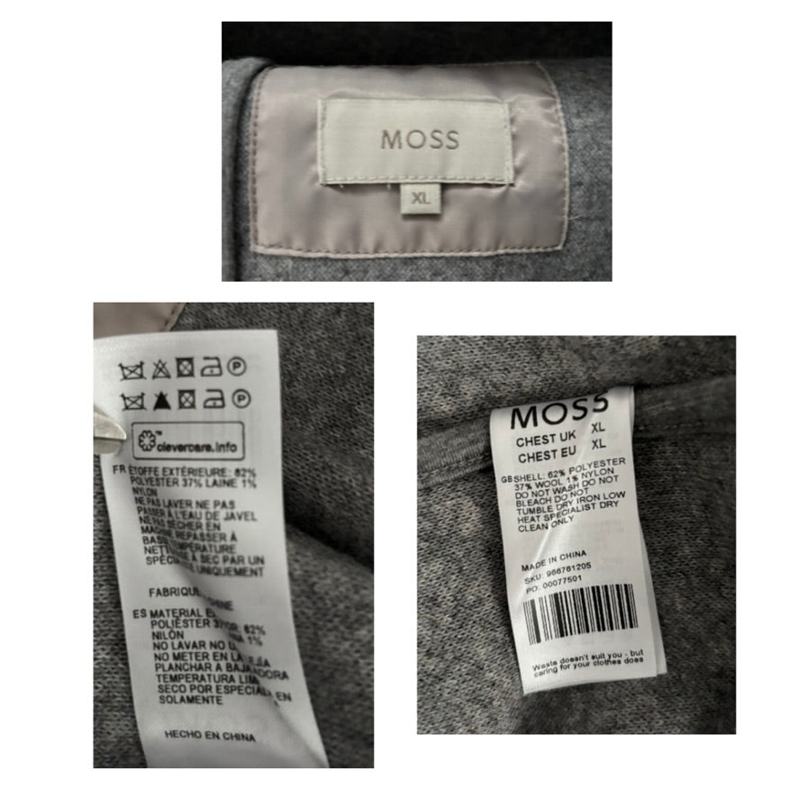 Close-up of clothing labels with 'MOSS' branding on a gray fabric background.
