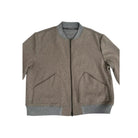 Brown jacket with gray trim on a white background