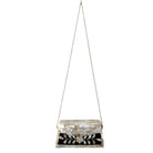 Mosiac handbag with black and white pattern on a white background