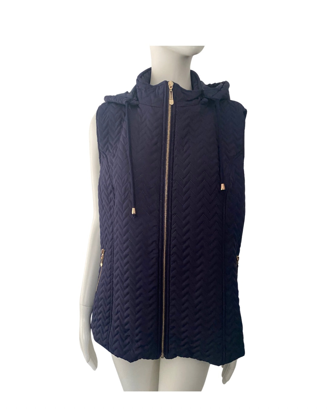Navy quilted vest with a hood on a mannequin against a white background