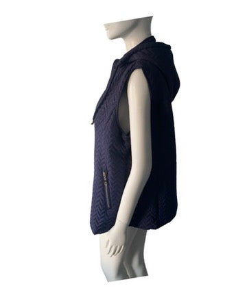 Navy blue quilted vest on a mannequin against a white background