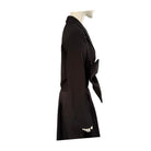 Black coat on a mannequin against a white background