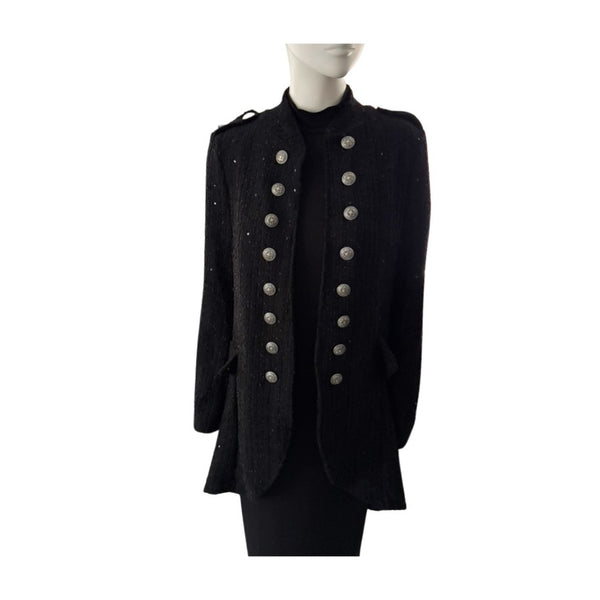 Black military-style jacket with button details on a mannequin against a white background