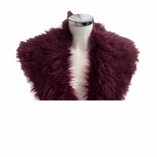 Burgundy shaggy fur shrug on a mannequin against a white background