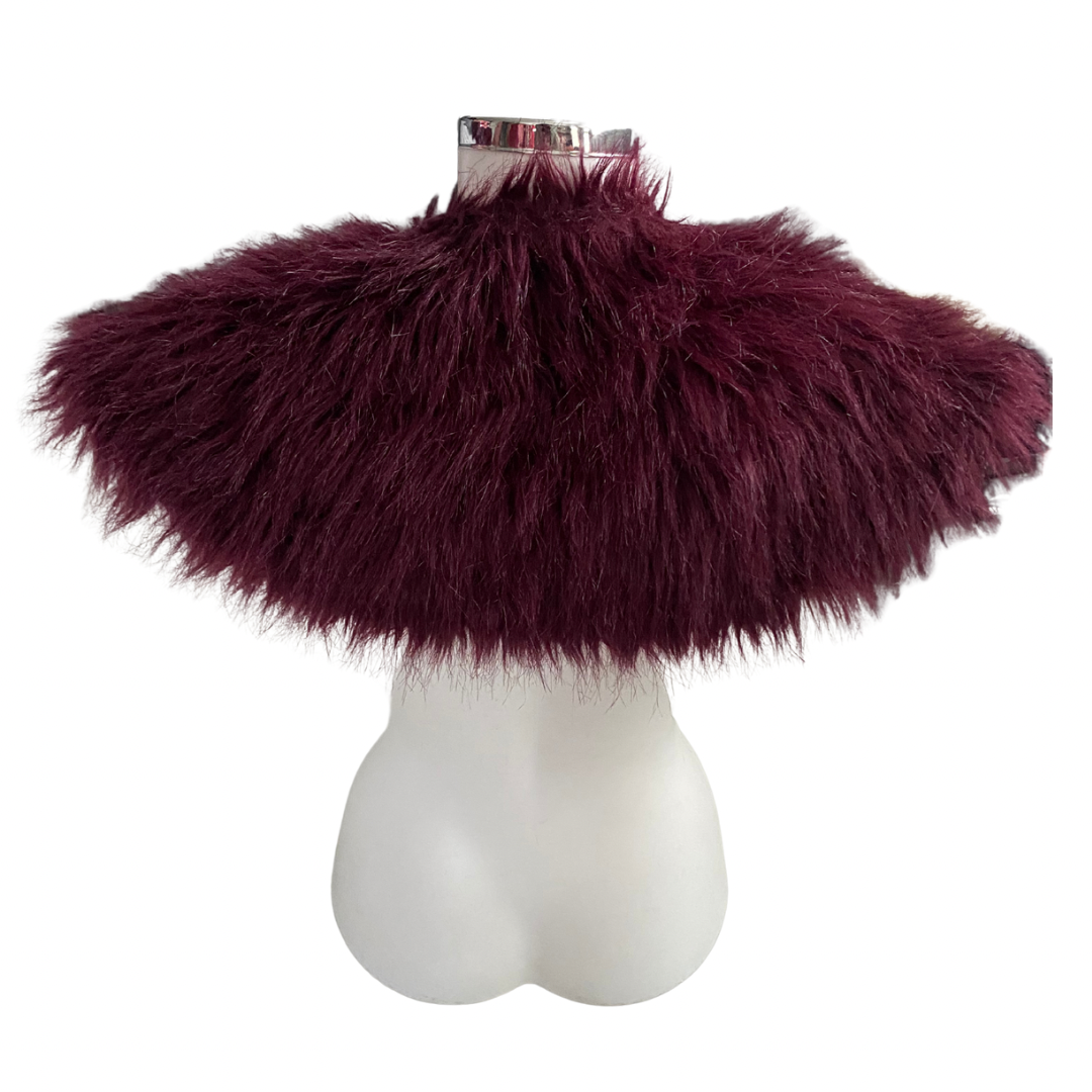 Burgundy fluffy shawl on a mannequin bust against a white background