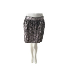 Dark Silver sequin skirt on a mannequin against a white background