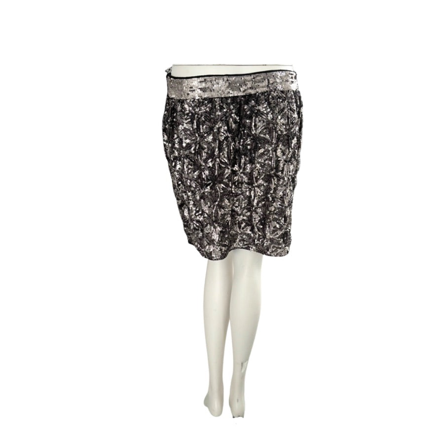 Black floral patterned skirt on a mannequin against a white background