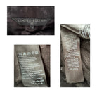 Close-up of clothing labels with text and symbols on a garment.