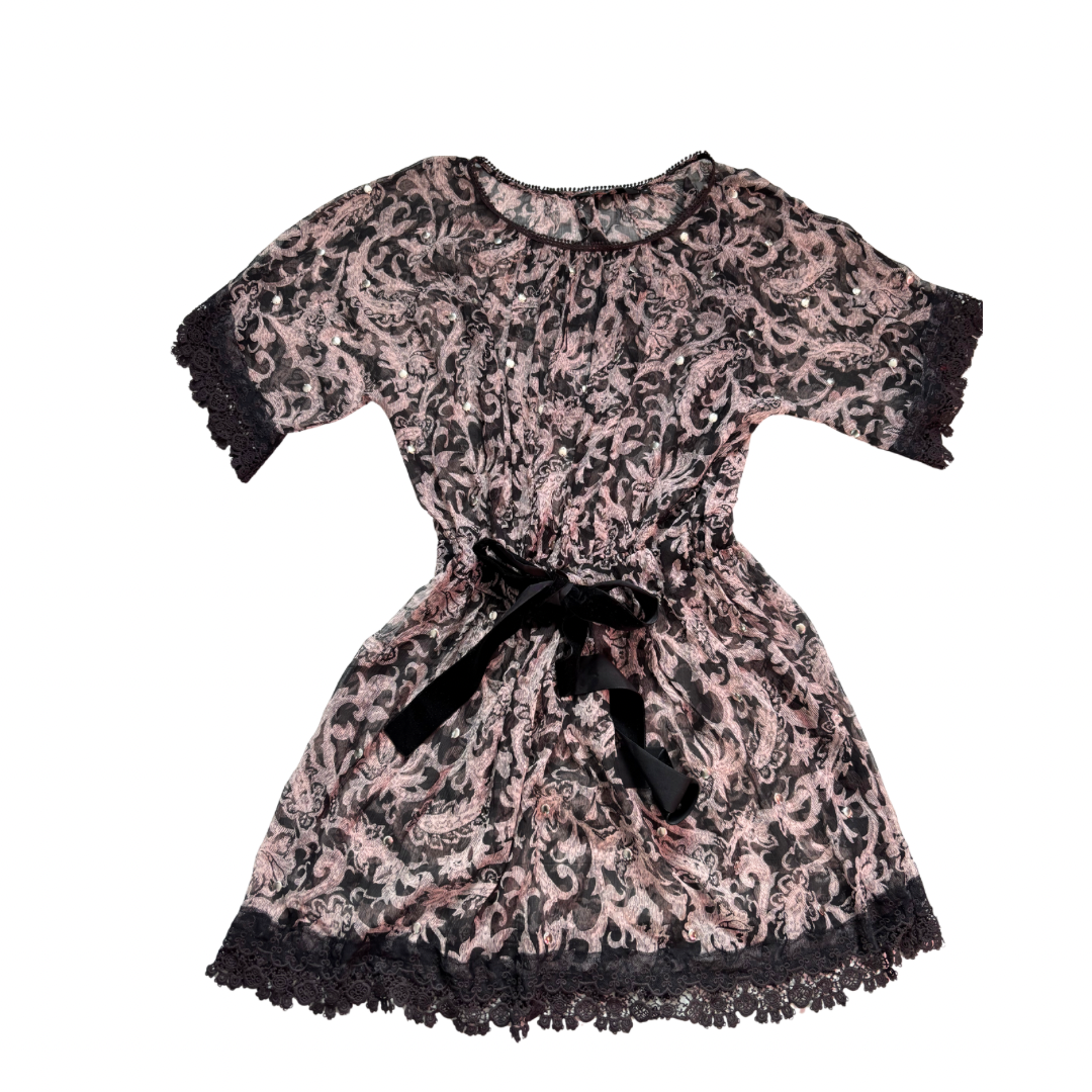 Black and pink lace overlay mini dress with velvet ribbon waist tie, Limited Edition, size 10, laid flat.
