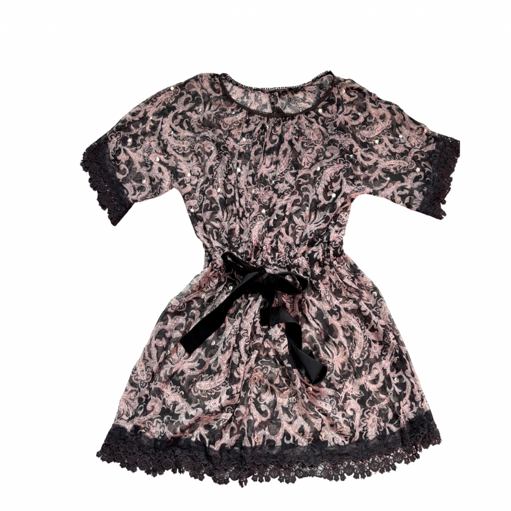 Black and pink lace overlay mini dress with velvet ribbon waist tie, Limited Edition, size 10, laid flat.

