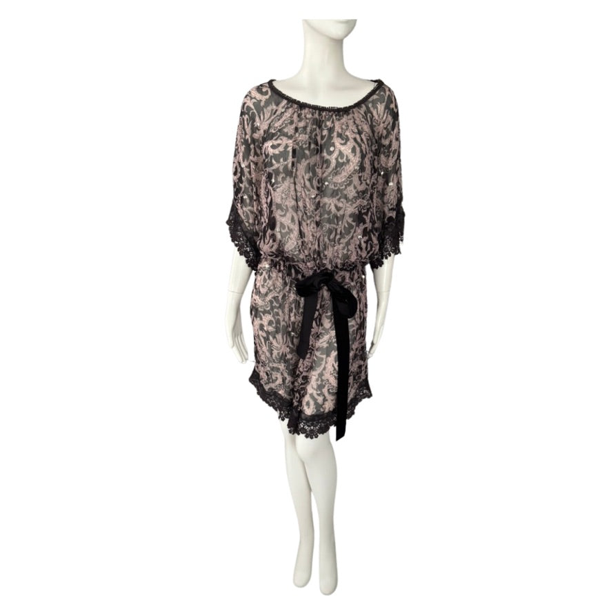 patterned dress on a mannequin against a white background