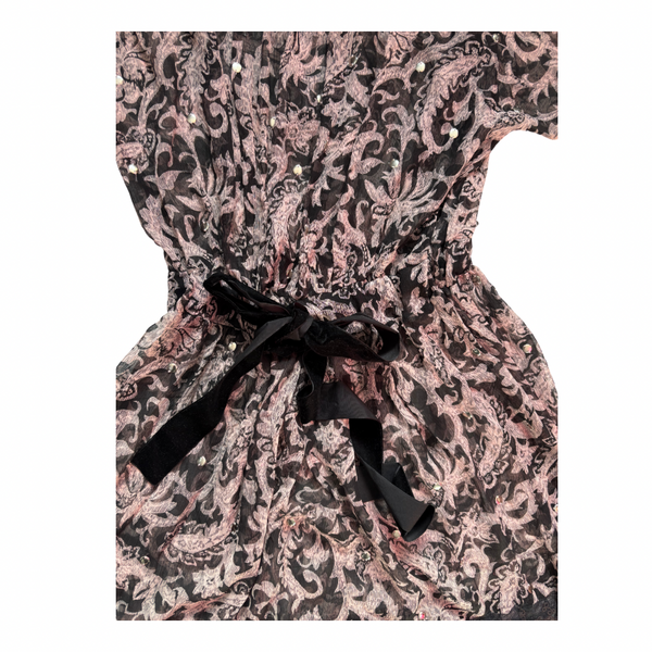Patterned dress with a black ribbon on a white background