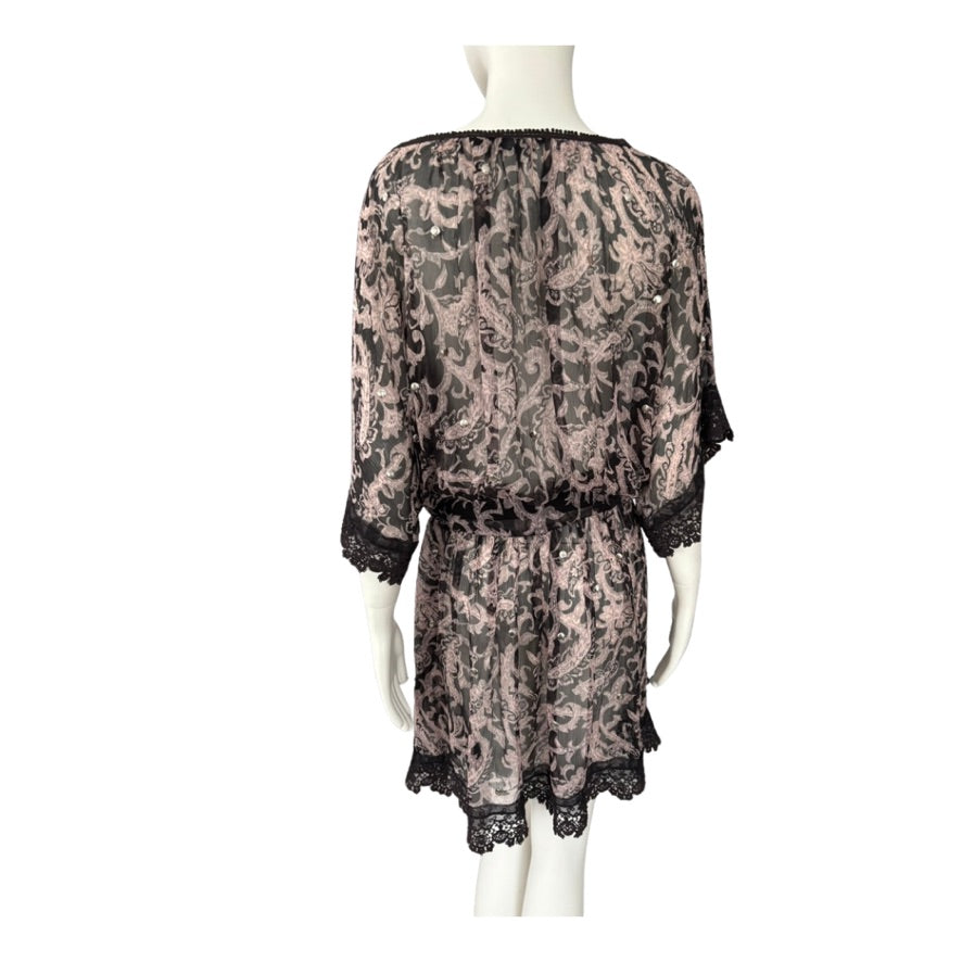 patterned dress on a mannequin against a white background