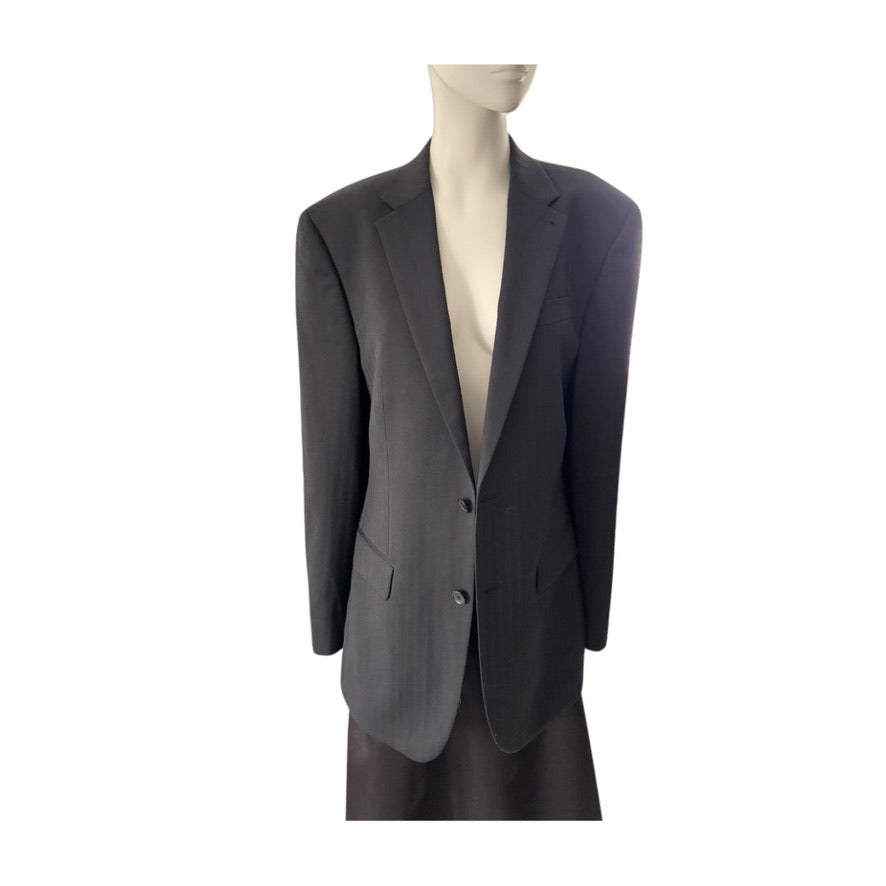 Black blazer on a mannequin against a white background