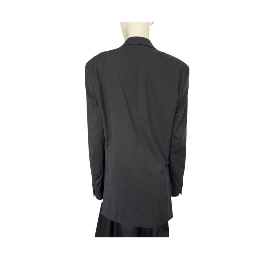 Black blazer on a mannequin against a white background