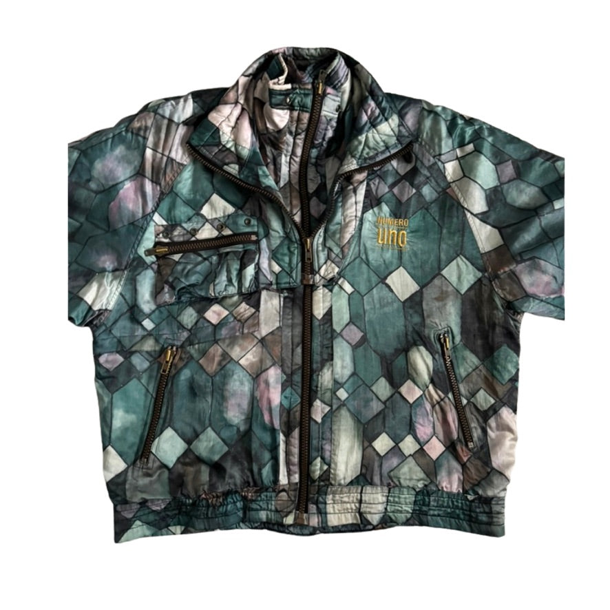 Multicolored patterned jacket with zippers on a white background