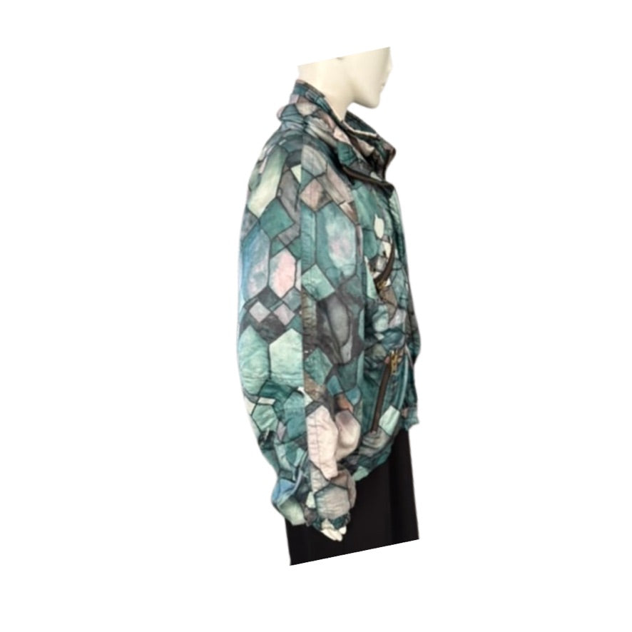 Multicolored patterned scarf on a mannequin against a white background