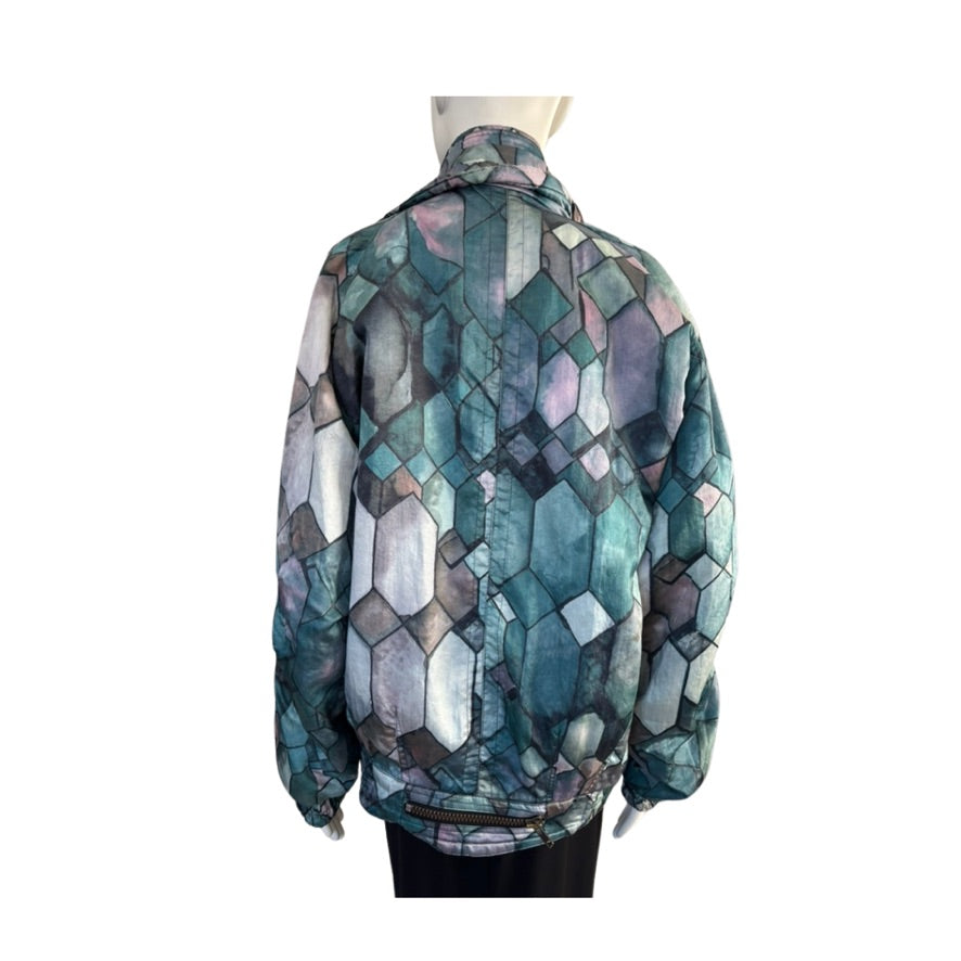 Multicolored geometric patterned jacket on a mannequin against a white background