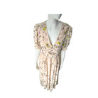 Floral dress on a mannequin against a white background