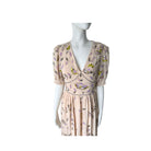 Mannequin wearing a floral dress on a white background