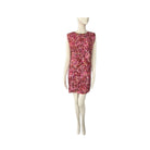 Mannequin wearing a pink floral dress on a white background