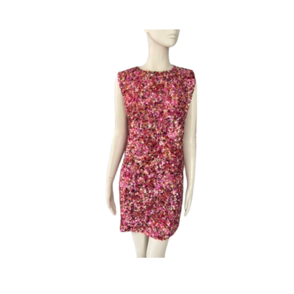 Mannequin wearing a pink floral dress on a white background