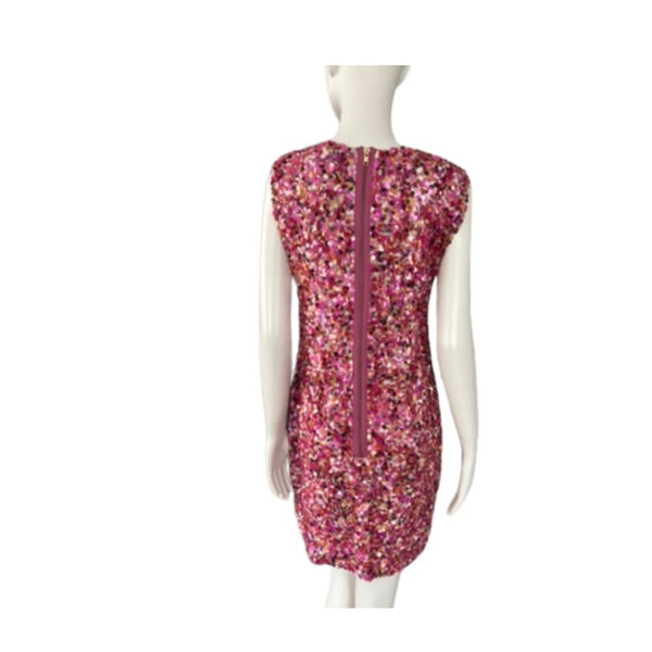 Mannequin wearing a pink sequin dress on a white background