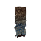 Patternedscarf with a mix of brown and blue colors on a white background.
