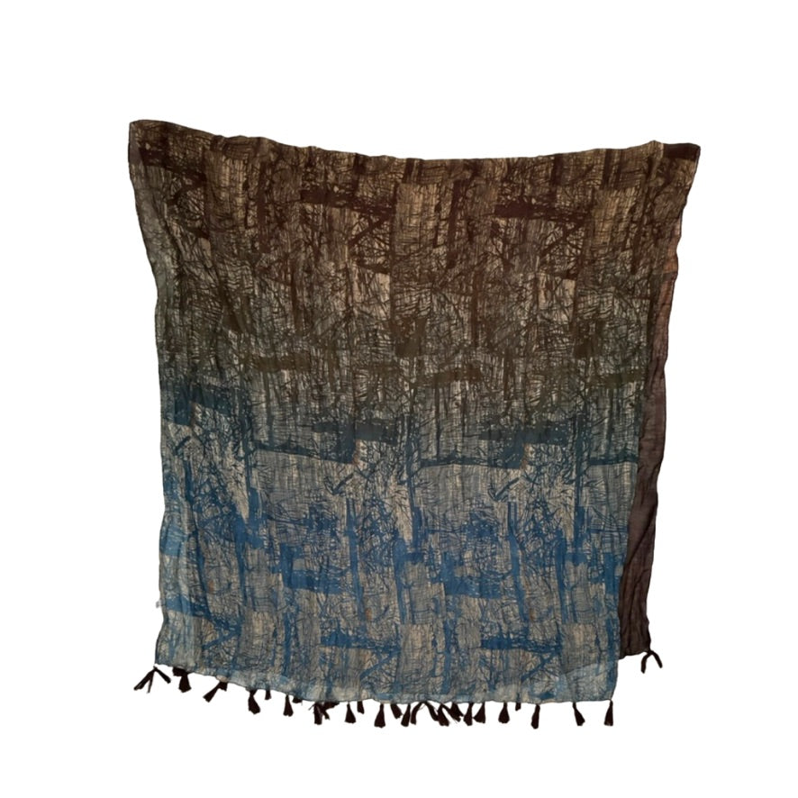 Patterned scarf with brown and blue pattern on a white background