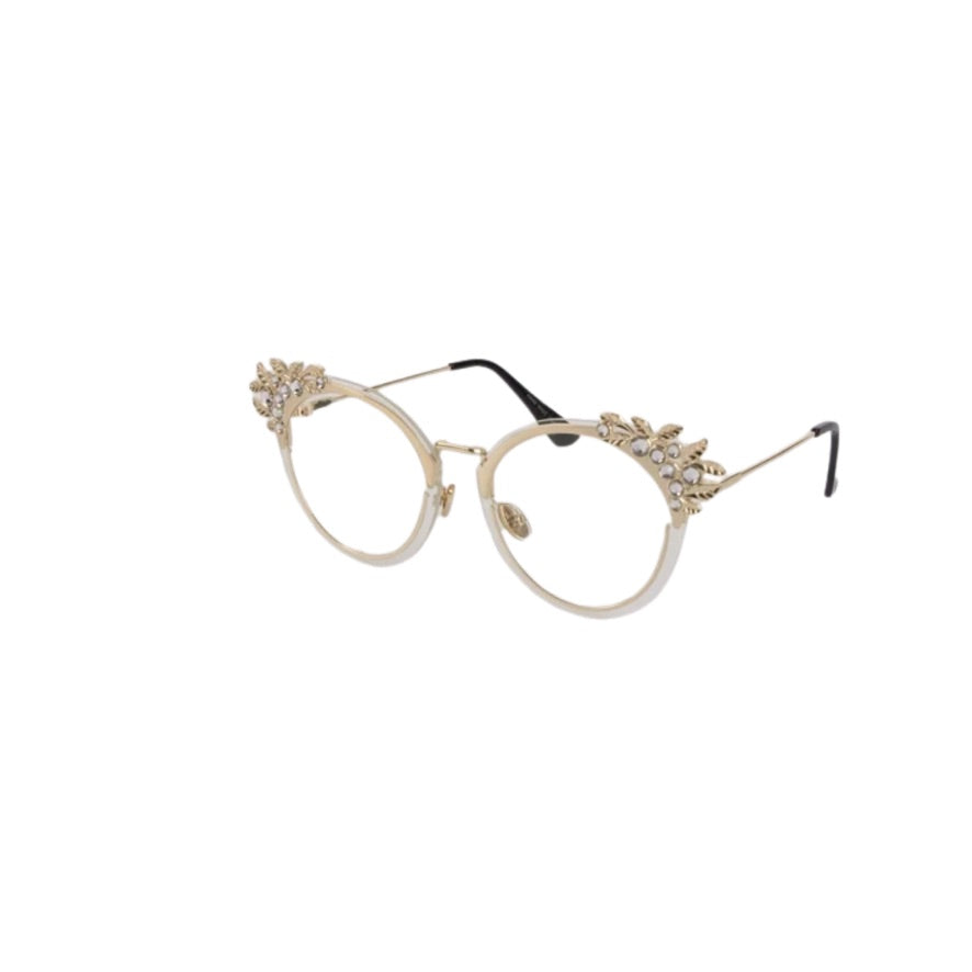 Decorative eyeglasses with embellishments on a white background