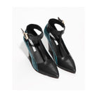 Black and teal high-heeled shoes with ankle straps on a white background