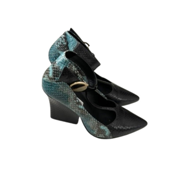 High-heeled shoes with snake print and black bow on a white background