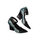 Black high-heeled shoes with turquoise snake print on a white background