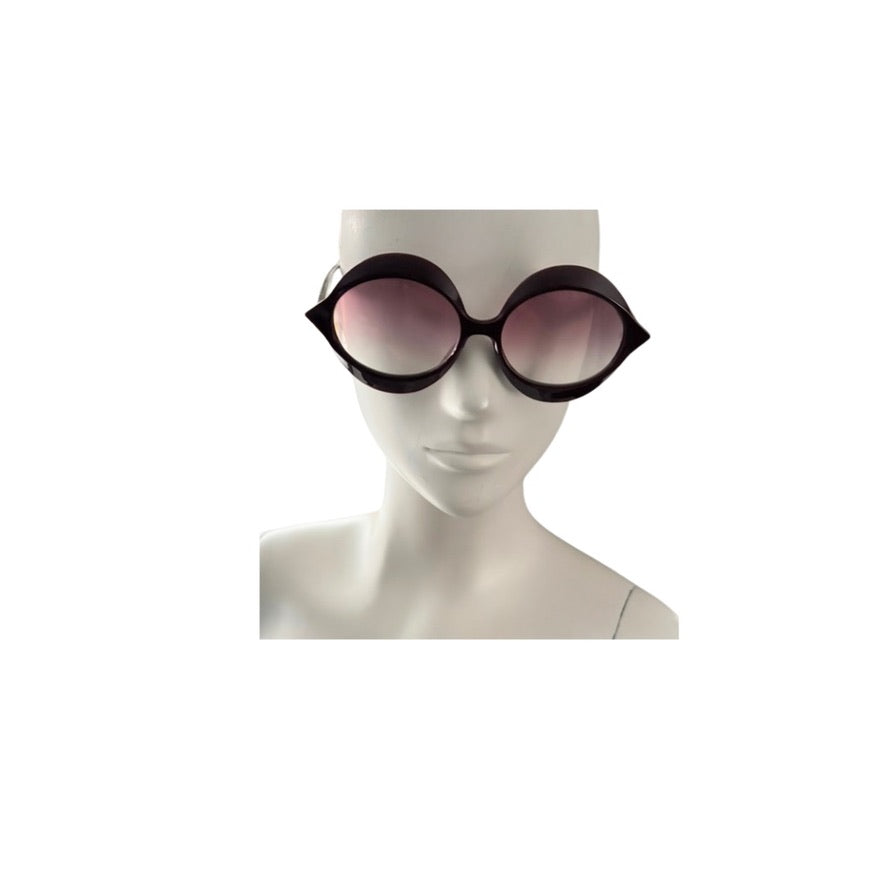 Sunglasses on a mannequin head with a white background