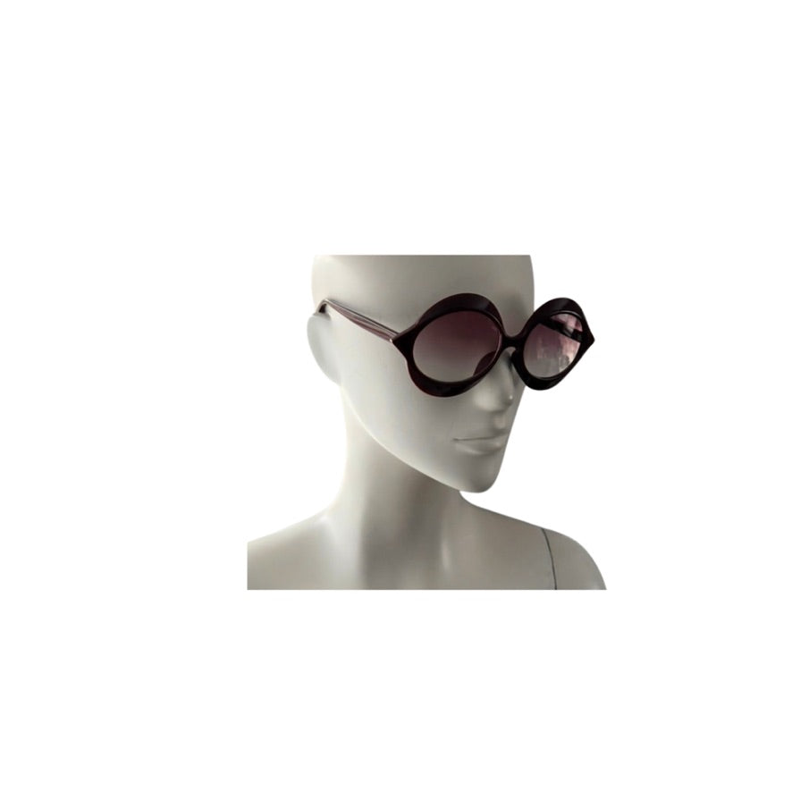 Sunglasses on a mannequin head against a white background