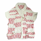 A chunky knit sleeveless cardigan in pink and cream colors with a shawl collar and deep front pockets.