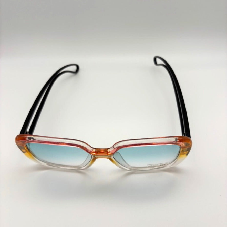 Sunglasses with black frames and red-orange gradient lenses on a light gray background