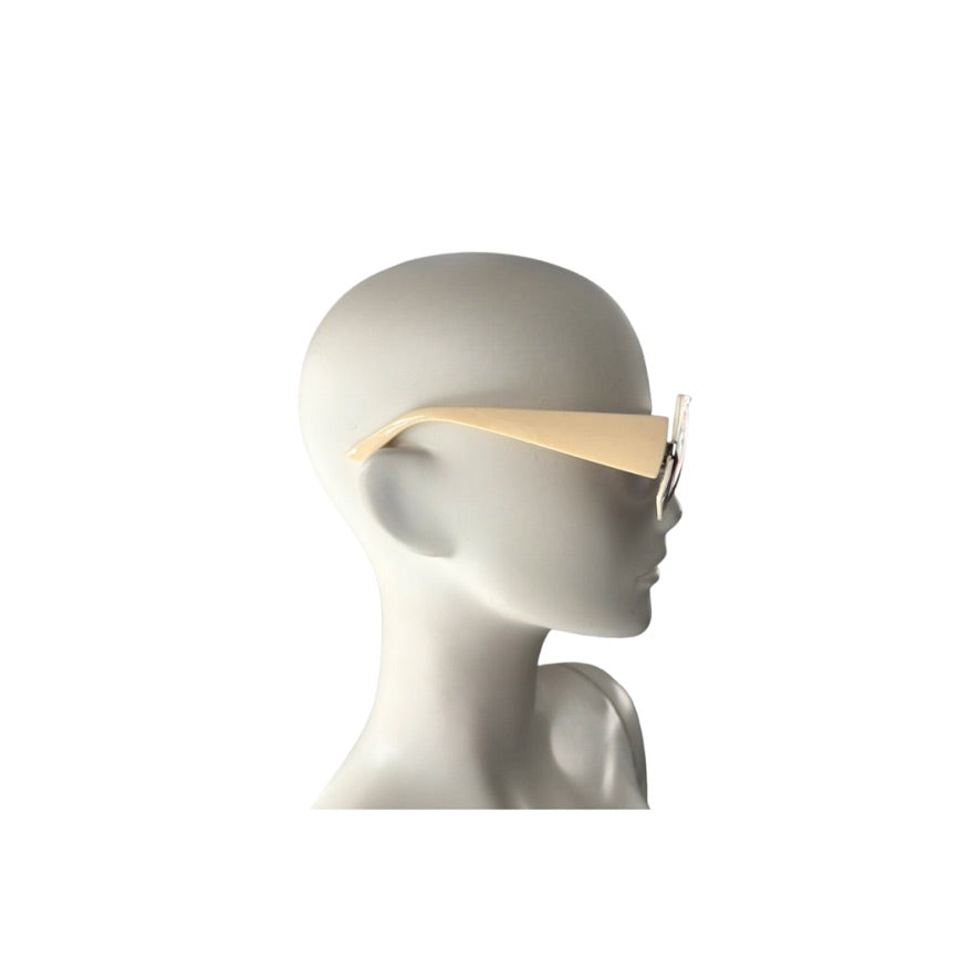 Mannequin head wearing a beige headband on a white background