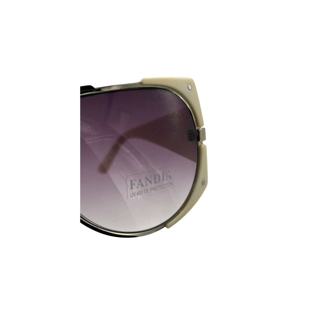 Sunglasses with a gradient purple lens and beige frame on a white background