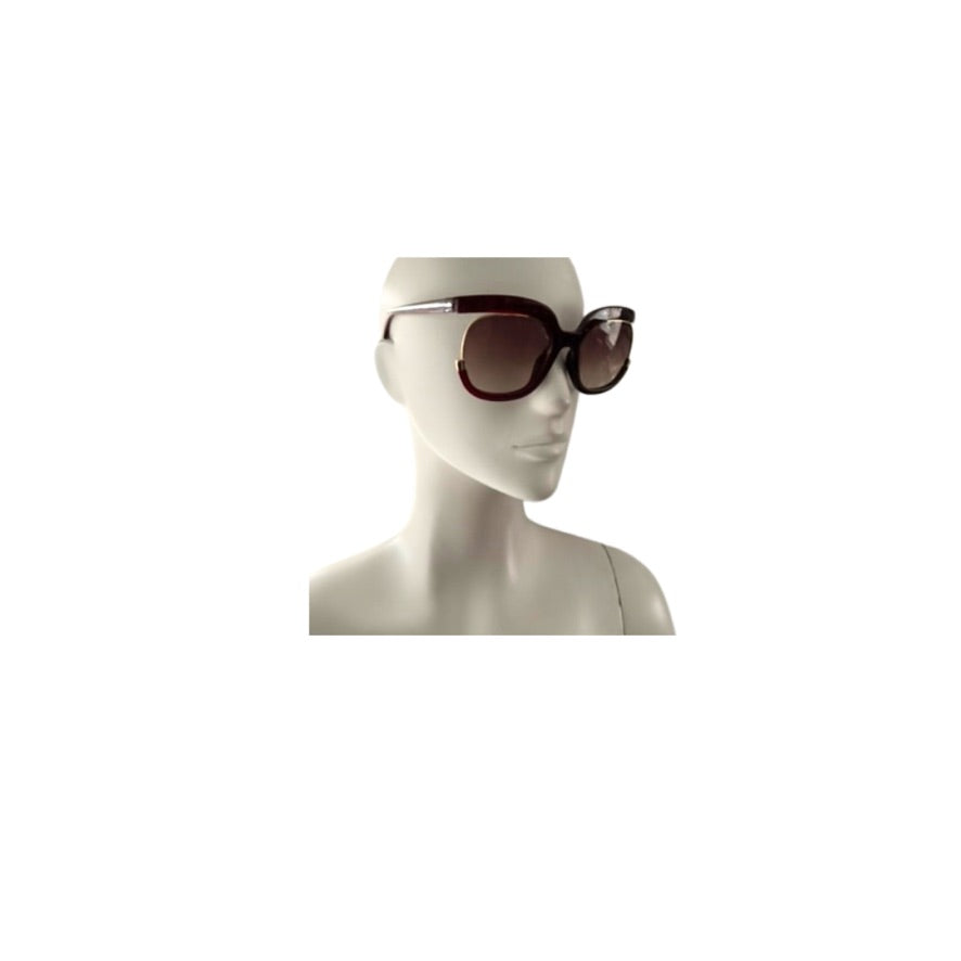 Sunglasses on a mannequin head against a white background