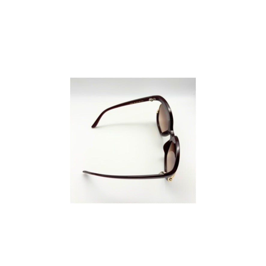 Sunglasses with brown frame and lenses on a white background