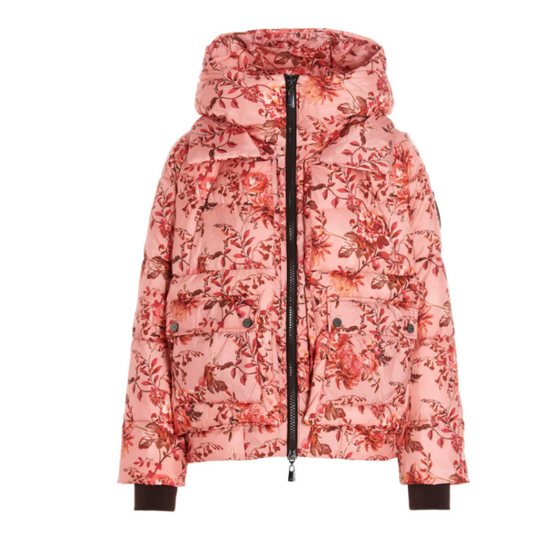 A floral pink puffer jacket with a high neck, zip front, and large square flap pockets, hooded design, with a botanical print including shades of blush and coral.