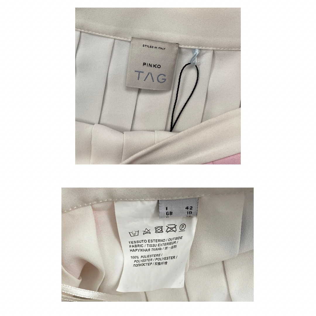 Close-up of a Pinko label on a garment with additional text and symbols.