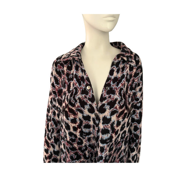 Mannequin wearing a leopard print cardigan on a white background