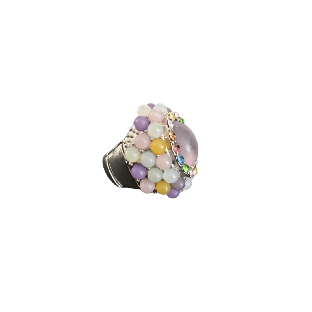 Multicolored beaded ring on a white background