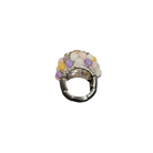 Decorative ring charm with multicolored beads on a white background
